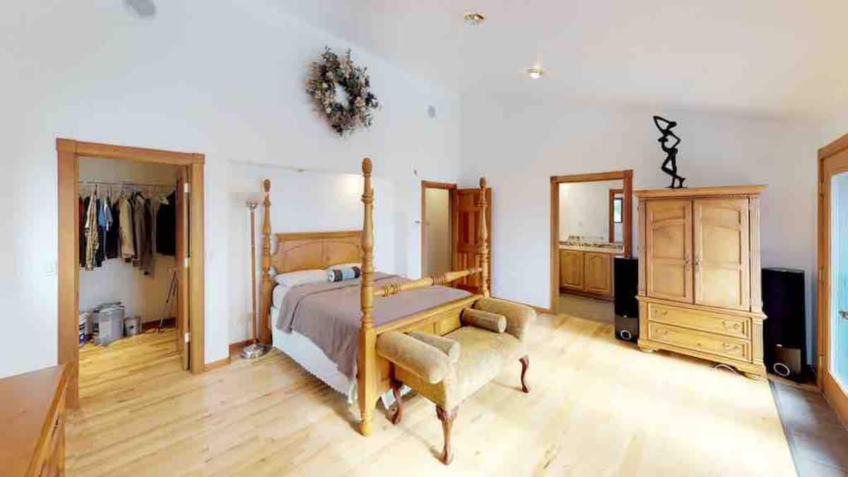 Primary master bedroom with four-poster bed