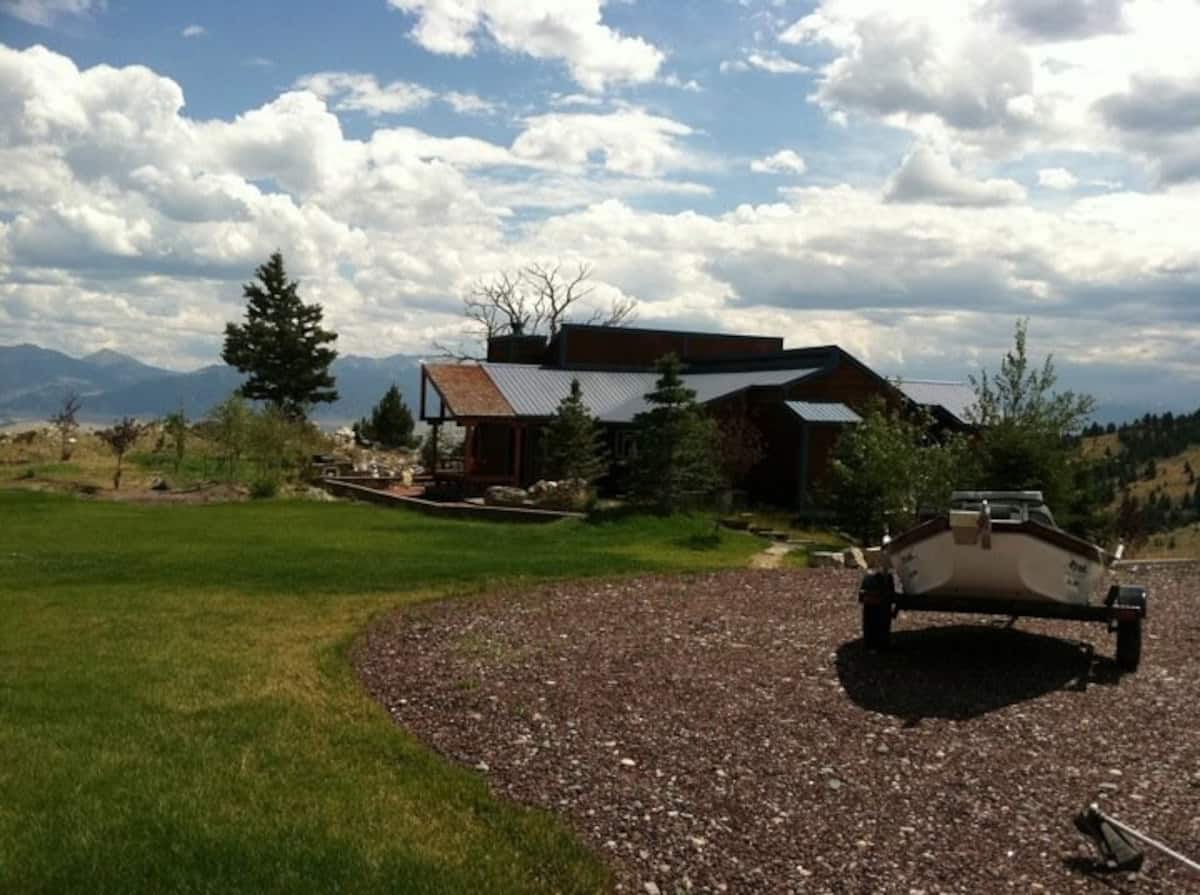 The whole property in summer with drift boat on trailer