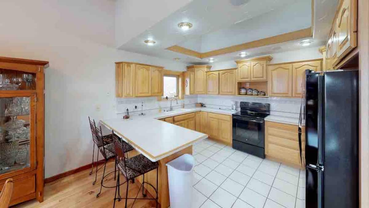 Kitchen with island bar seating