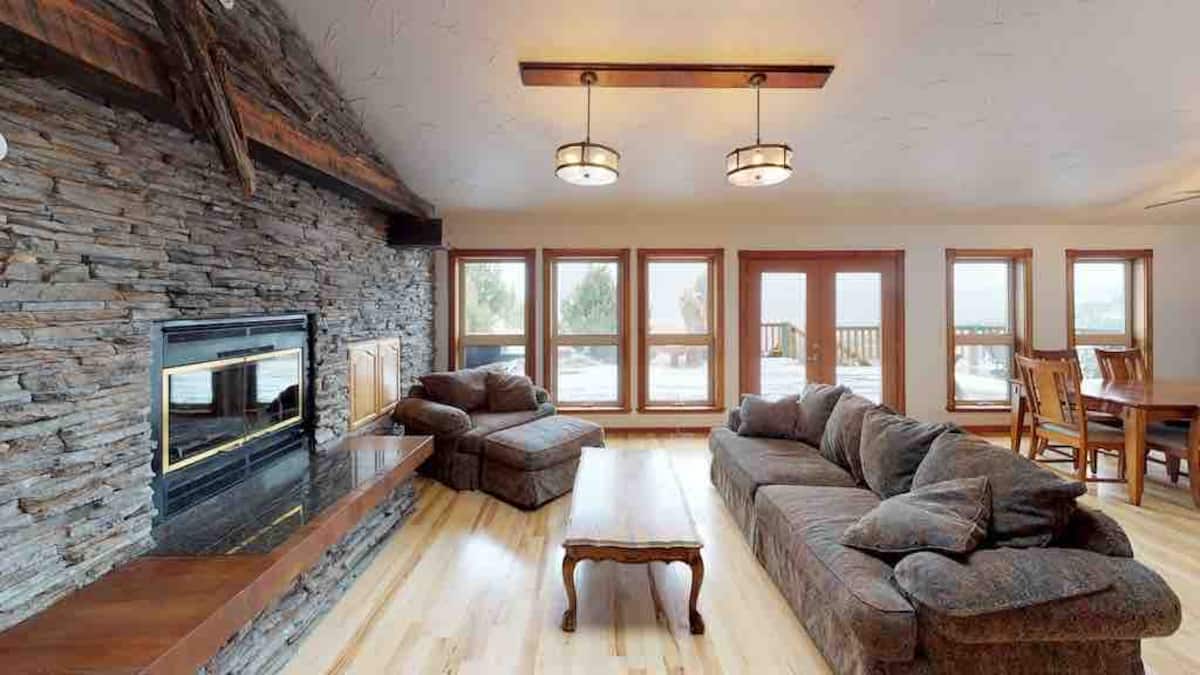 Living room with stone fireplace